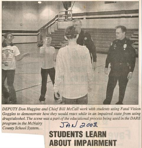 Deputy Don Huggins and Adamsville Police Chief Bill McCall Doing Public Service