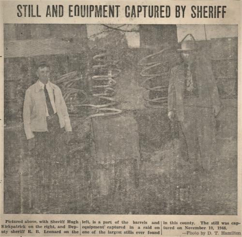 Sheriff Kirkpatrick and Deputy R B Leonard Capture One of the Largest Stills in County